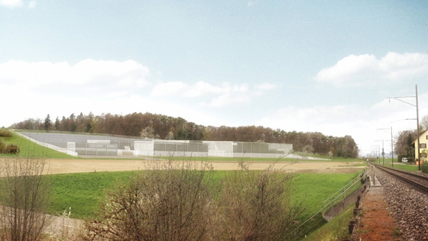 Intégration possible de l’installation de surface dans les environs avec l’exemple de l’installation de surface pour les dépôts de déchets hautement radioactifs (DHR), vue orientée à l’ouest (Bergholz). Représentation réaliste des variantes possibles avec une installation d’emballage de DHR enfouie.